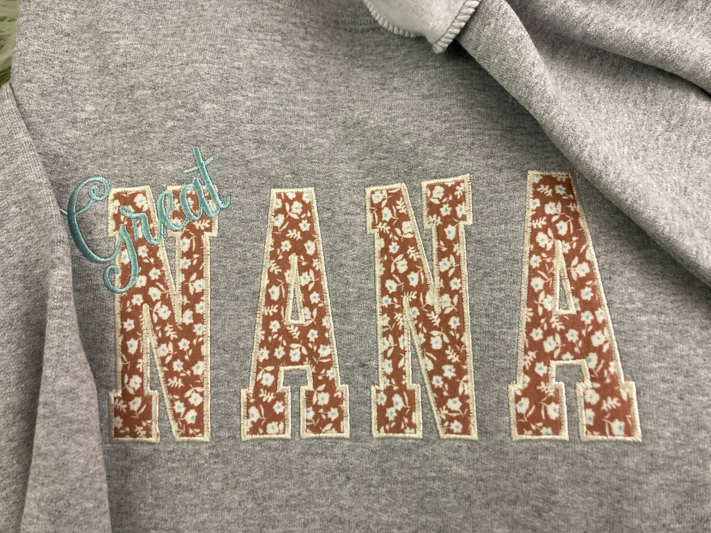 Applique keepsake sweatshirt made from baby onesies for grandma - design close up