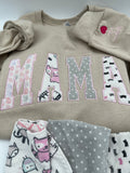 Curved Mama keepsake sweatshirt appliqued from baby clothes