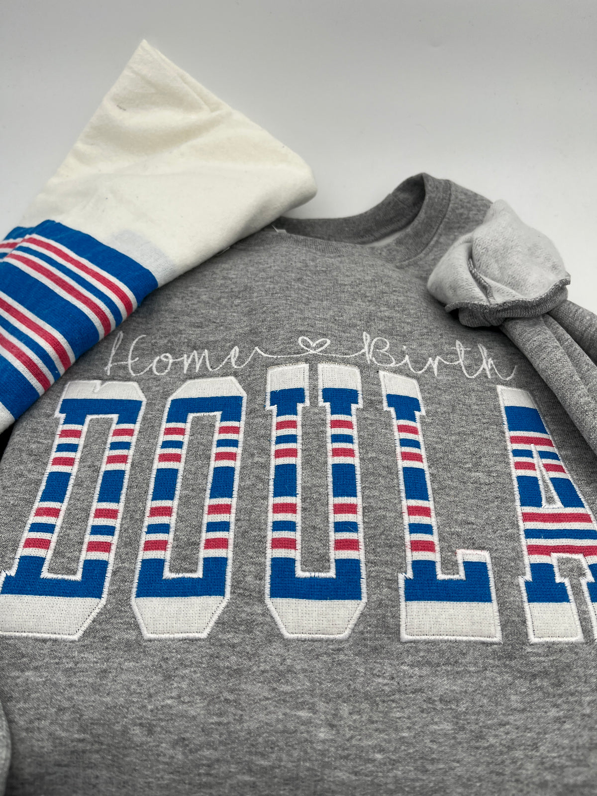 Doula embroidered sweatshirt with keepsake swaddle blanket detail - detail view