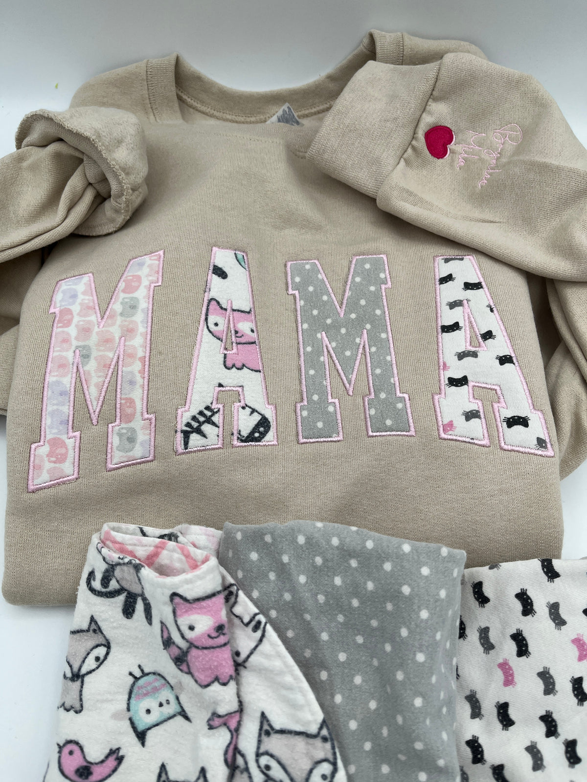 Curved Mama keepsake sweatshirt appliqued from baby clothes - fabric detail