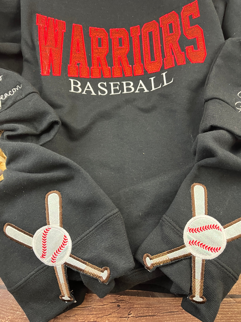 Custom baseball sweatshirt with glitter applique team name embroidery - detail view