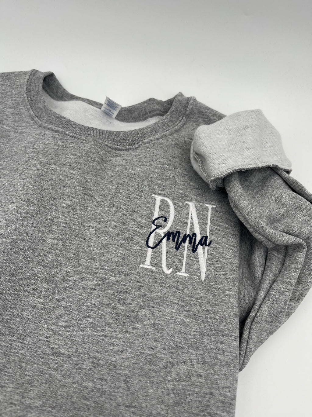 Custom nurse sweatshirt with left chest embroidered name and credentials