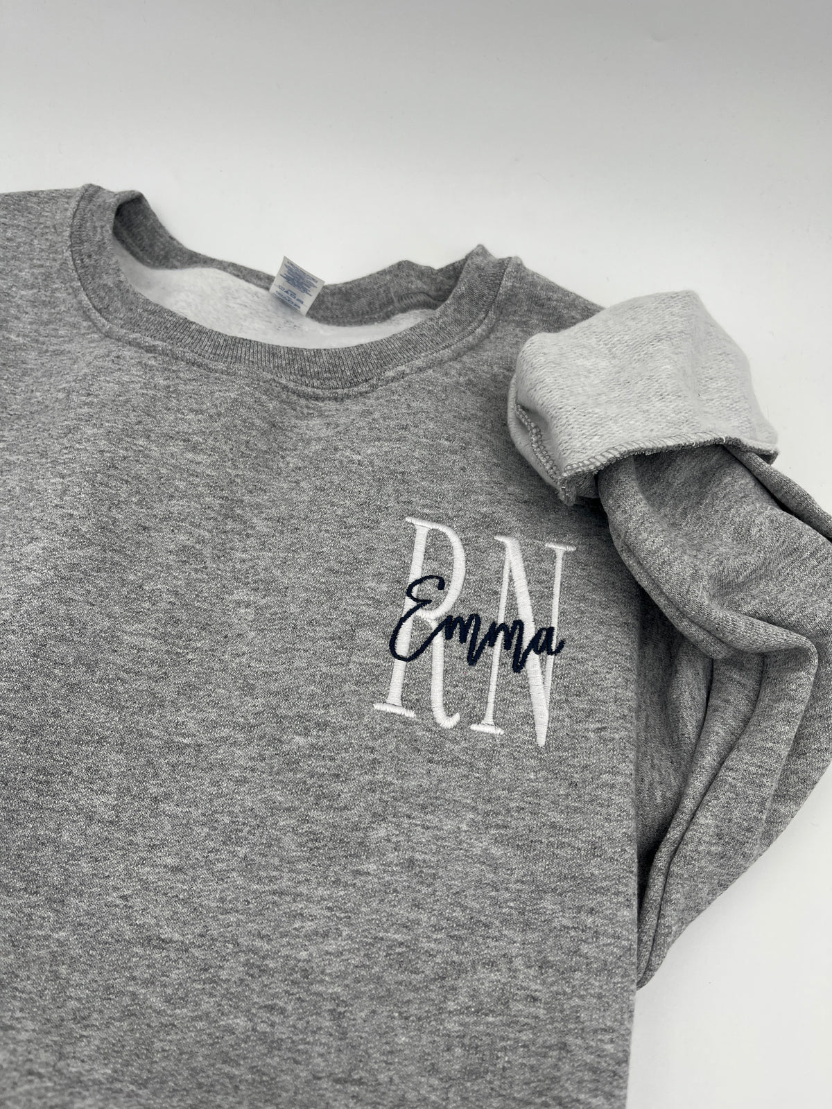 Custom nurse sweatshirt with left chest embroidered name and credentials