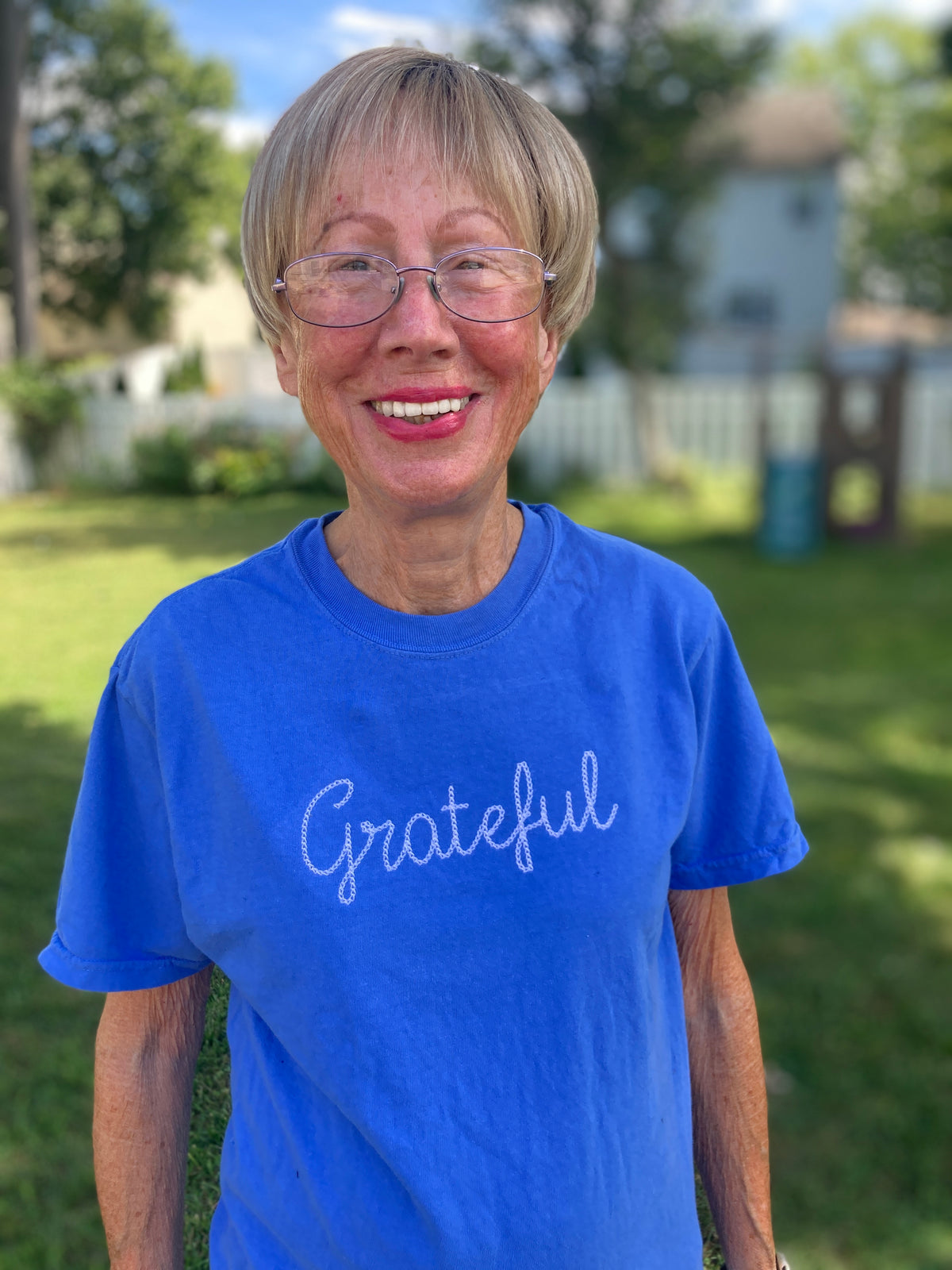 Grateful embroidered Christian sweatshirt with faith lettering - close up view