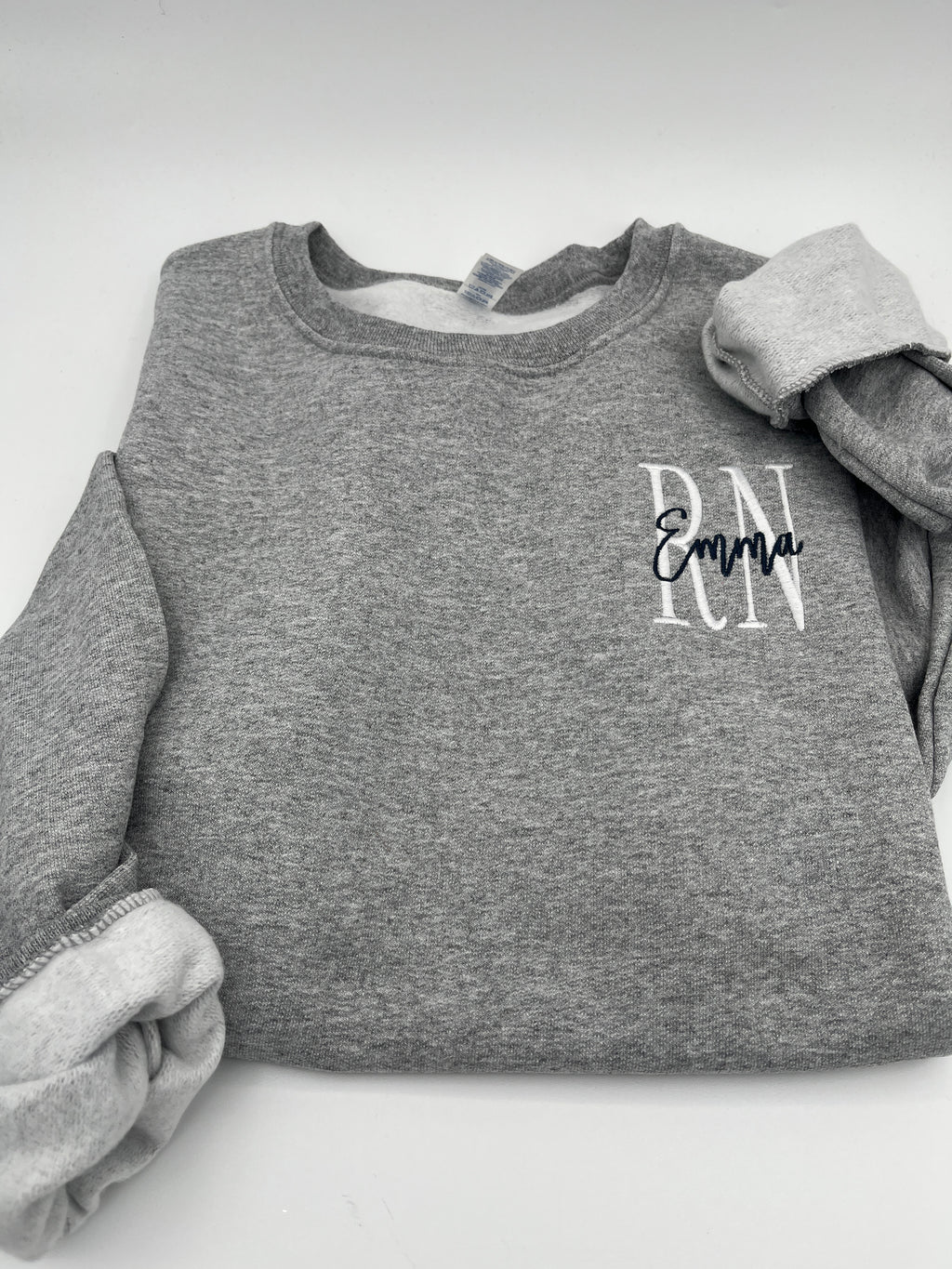 Custom nurse sweatshirt with left chest embroidered name and credentials - detail view