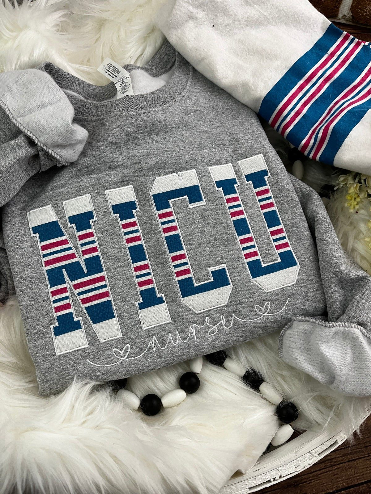 NICU nurse keepsake sweatshirt appliqued from a baby hospital blanket - fabric detail