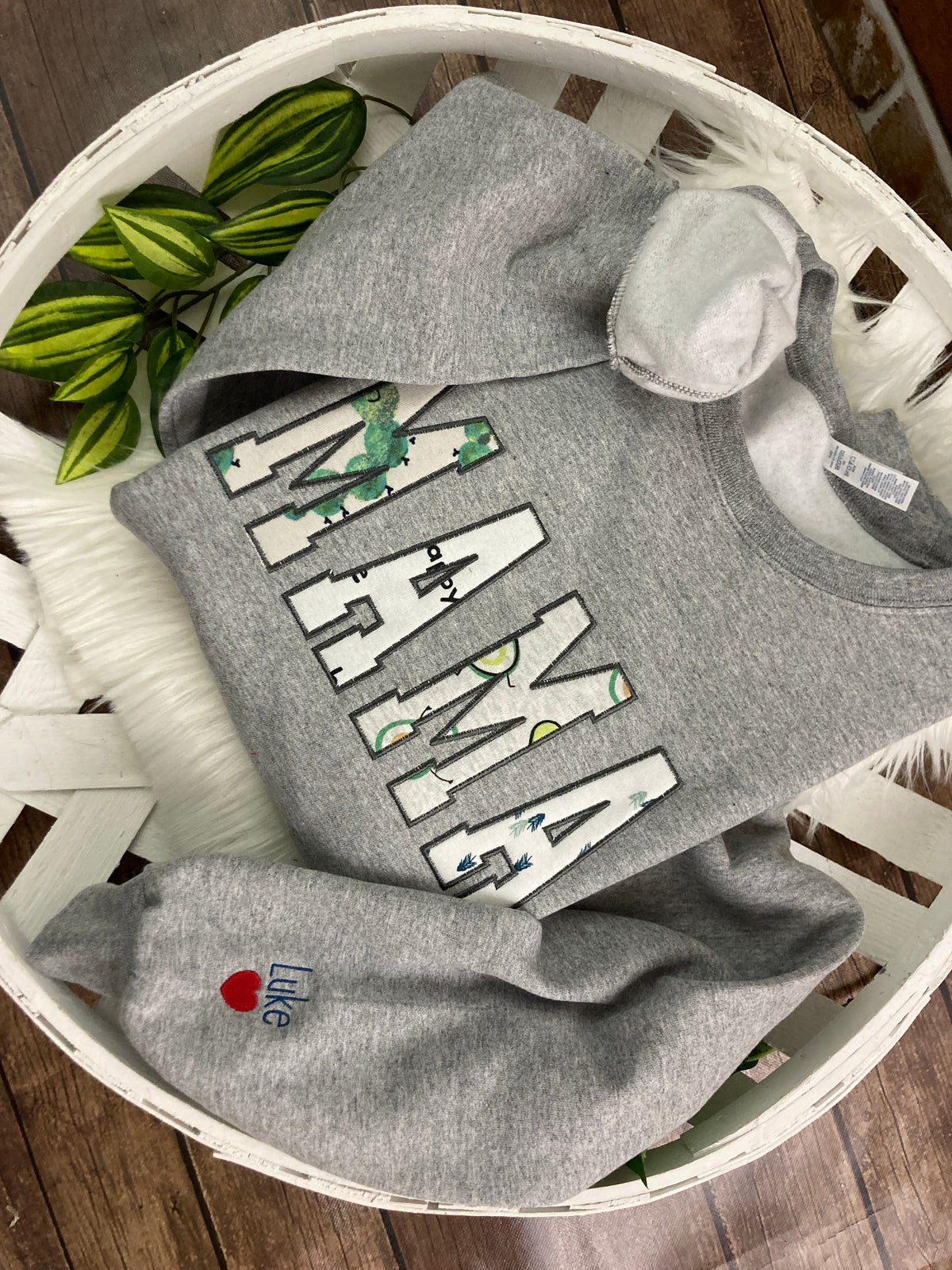 Applique keepsake sweatshirt made from baby onesies for grandma - detail view