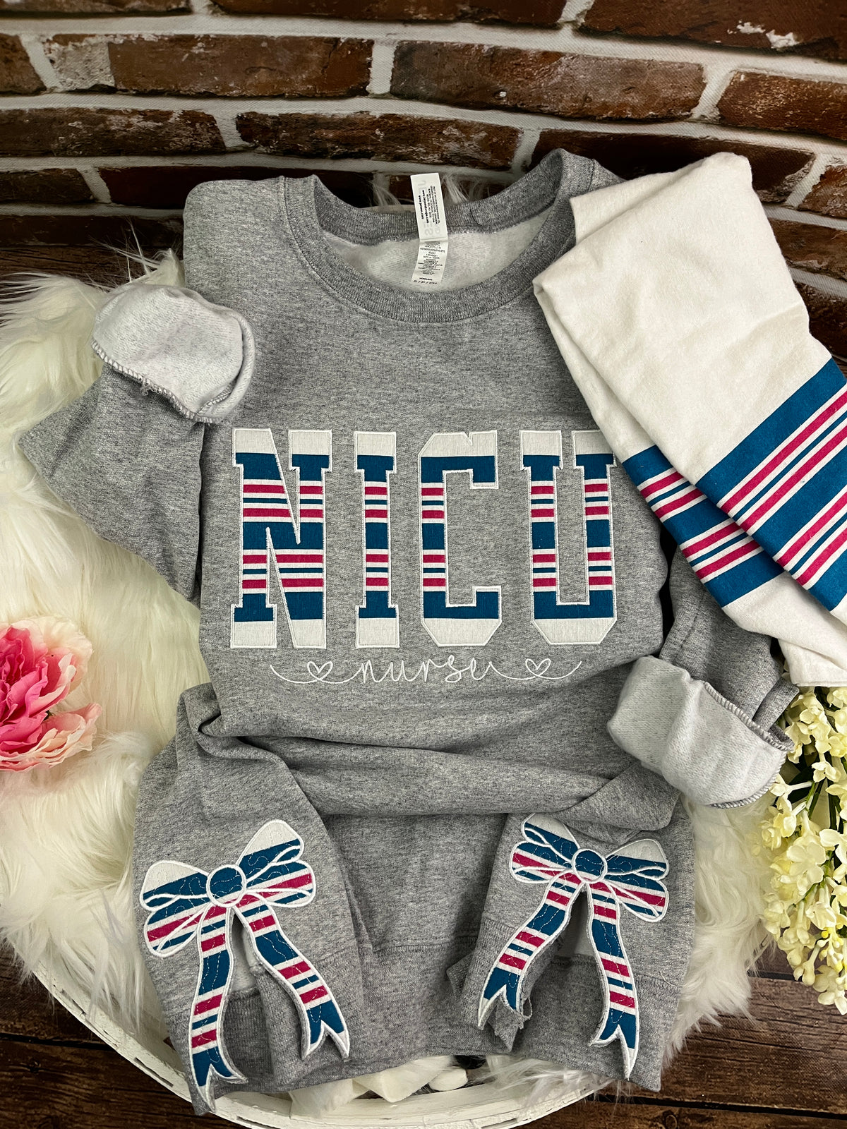 NICU nurse sweatshirt with side bows made from a swaddle blanket - detail view