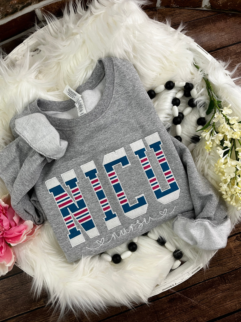 NICU nurse keepsake sweatshirt appliqued from a baby hospital blanket - close up view
