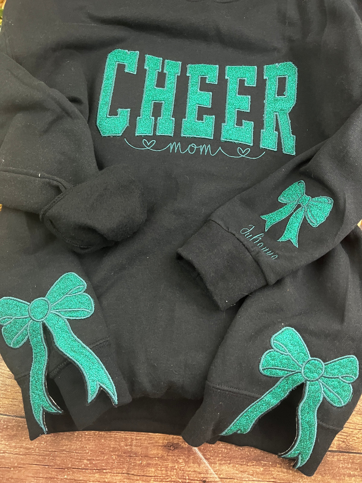 Custom cheer mom sweatshirt with side bows and glitter embroidery - detail view
