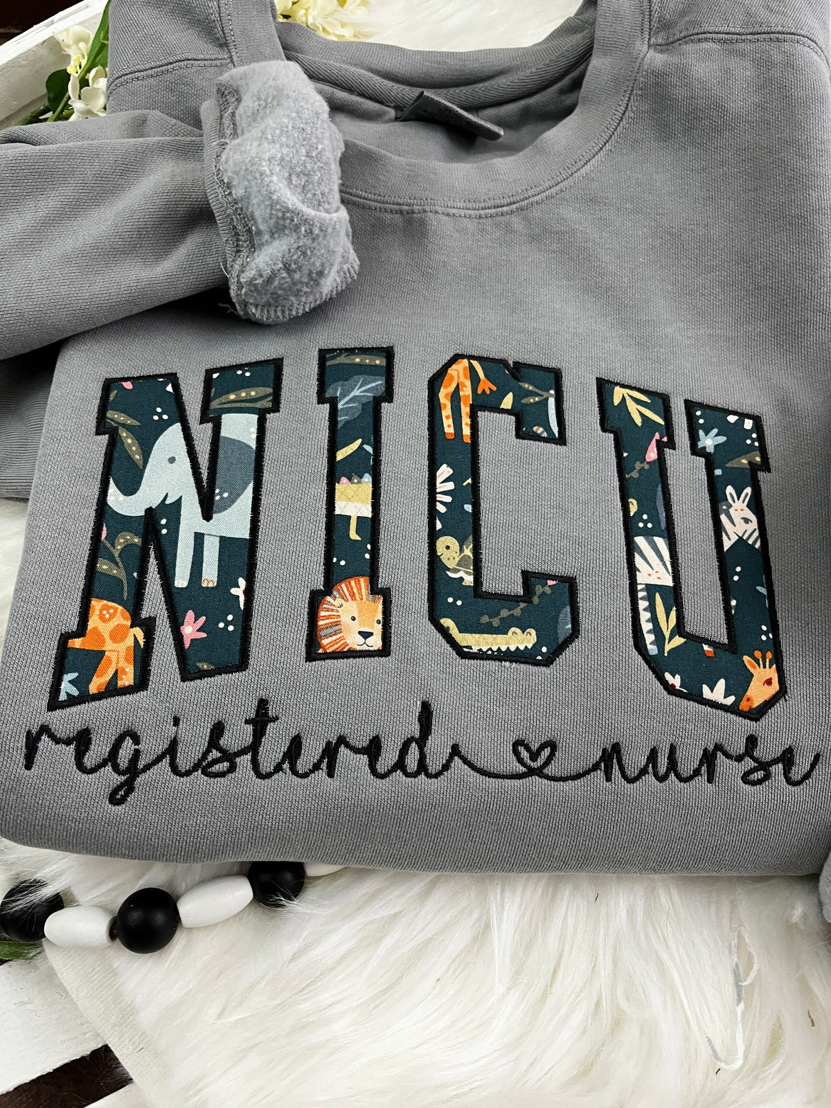 Curved NICU nurse keepsake sweatshirt from a baby swaddle blanket - detail view