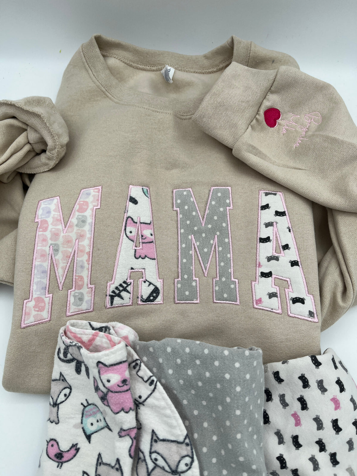 Curved Mama keepsake sweatshirt appliqued from baby clothes - close up view