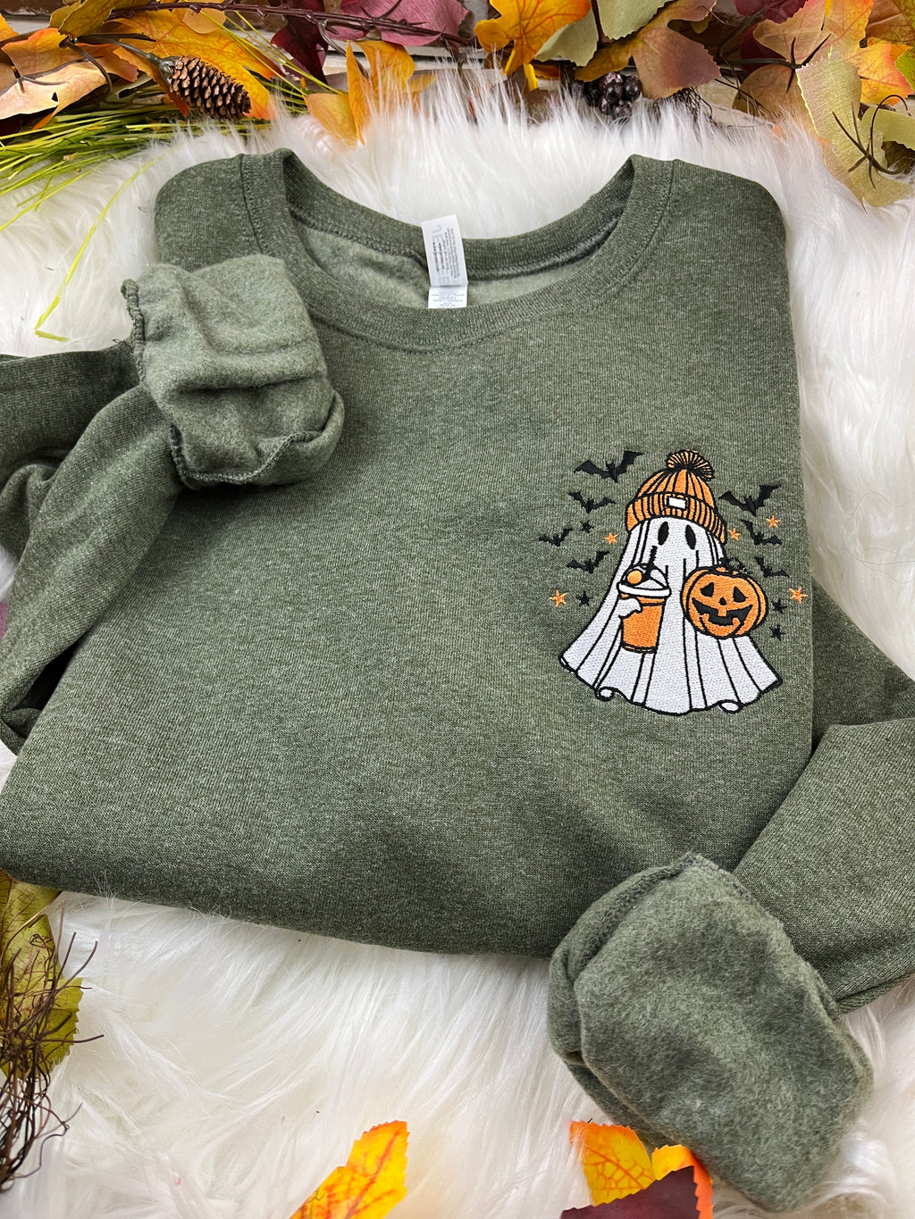 Embroidered spooky ghost sweatshirt with iced latte and orange beanie - detail view