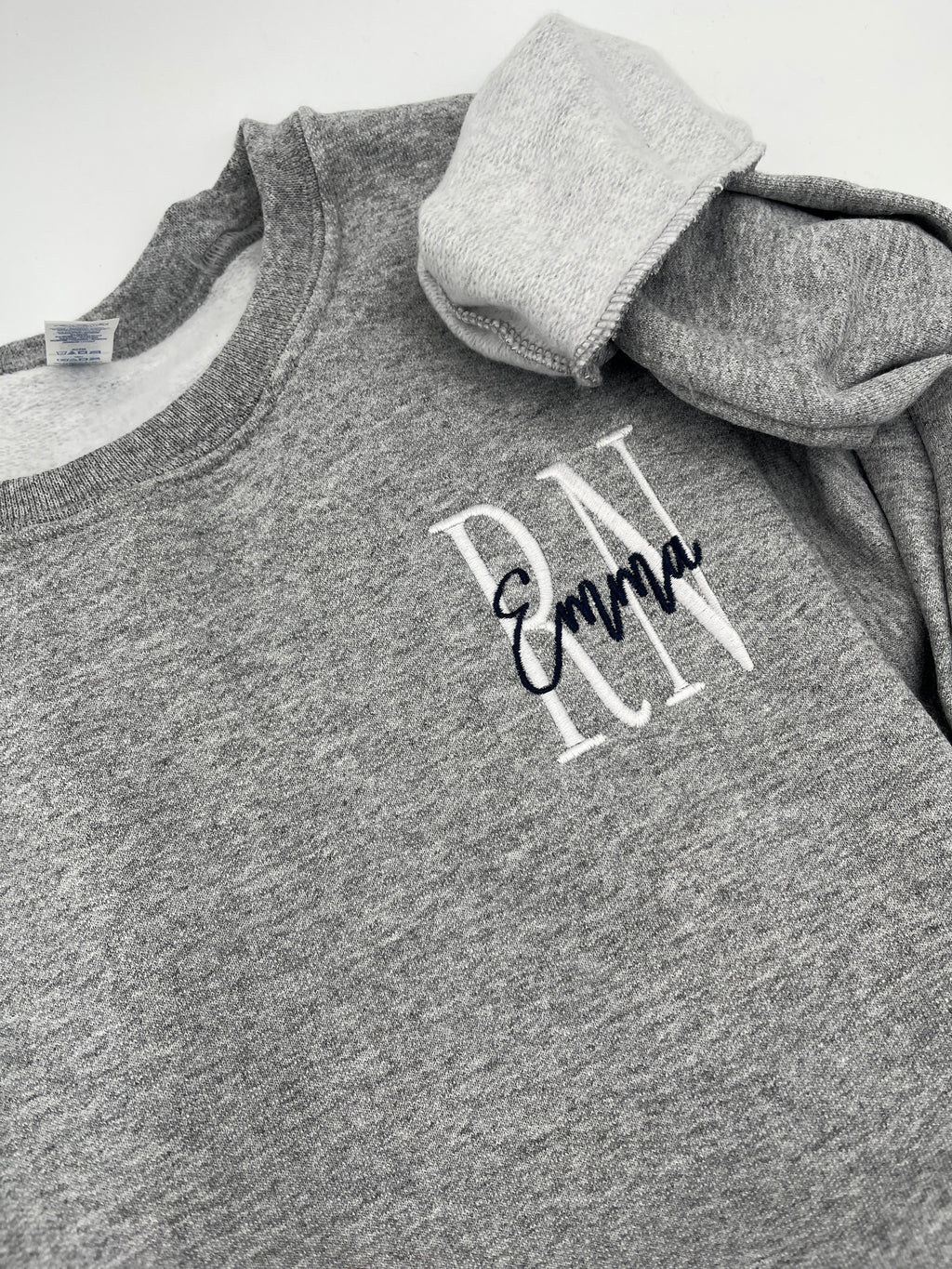 Custom nurse sweatshirt with left chest embroidered name and credentials - detail view 2