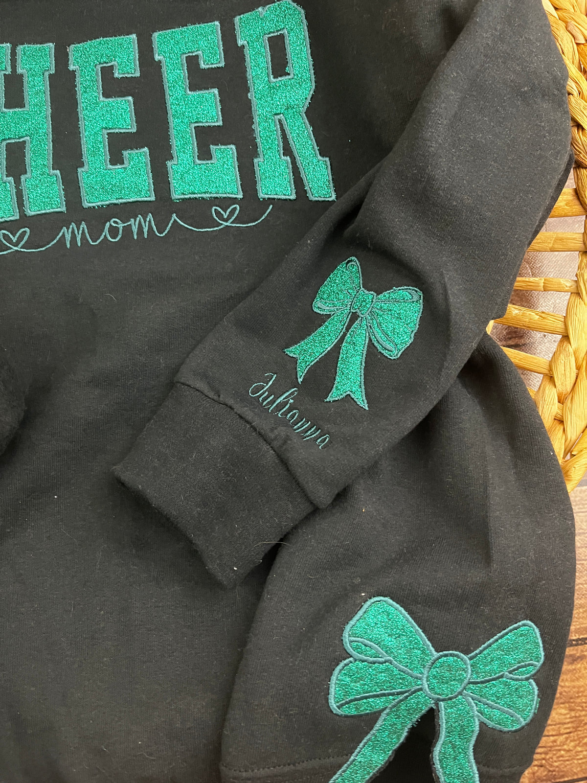 Custom cheer mom sweatshirt with side bows and glitter embroidery - design close up