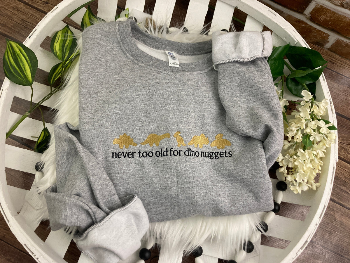 Never too old for dino nuggets embroidered sweatshirt