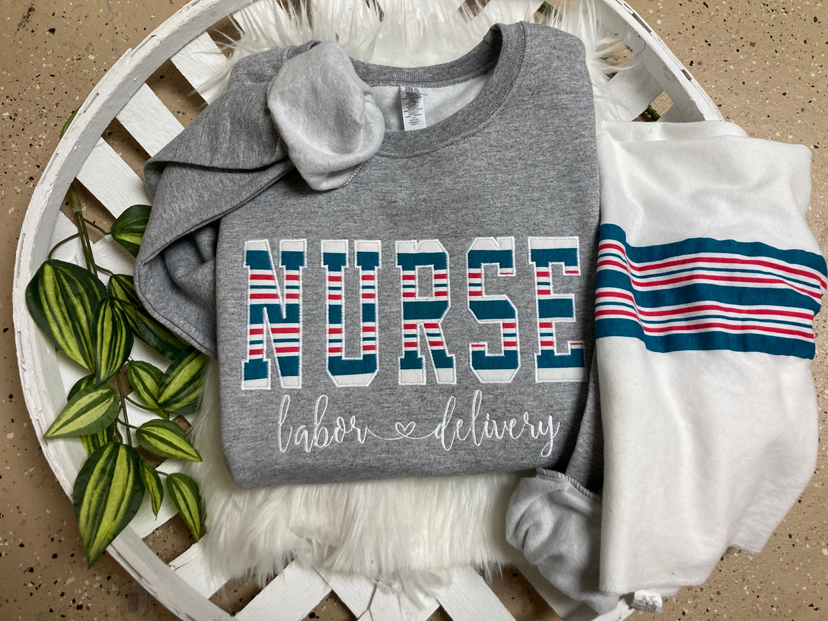 Bulk order nurse keepsake sweatshirts appliqued from hospital blankets - design close up