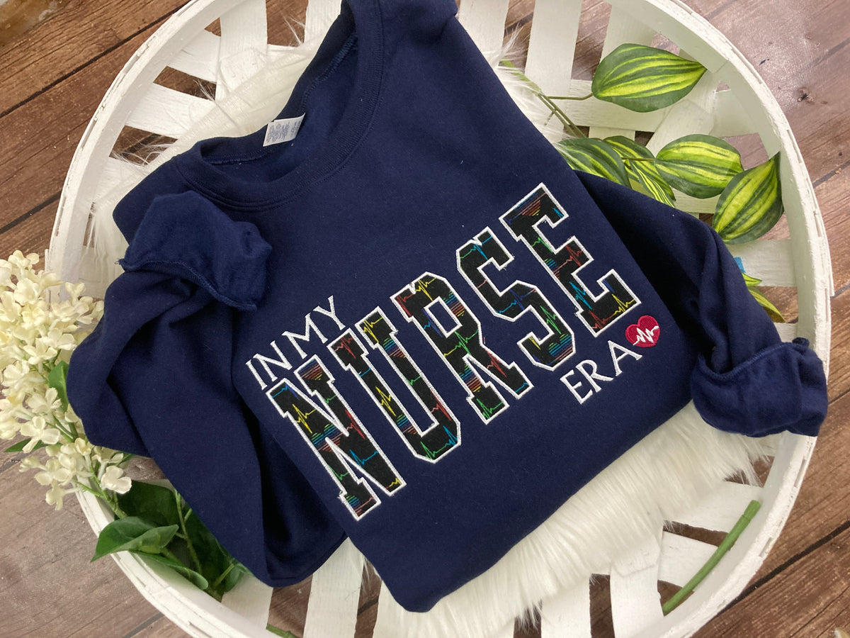 In my nurse era embroidered sweatshirt with rainbow heart EKG design - detail view