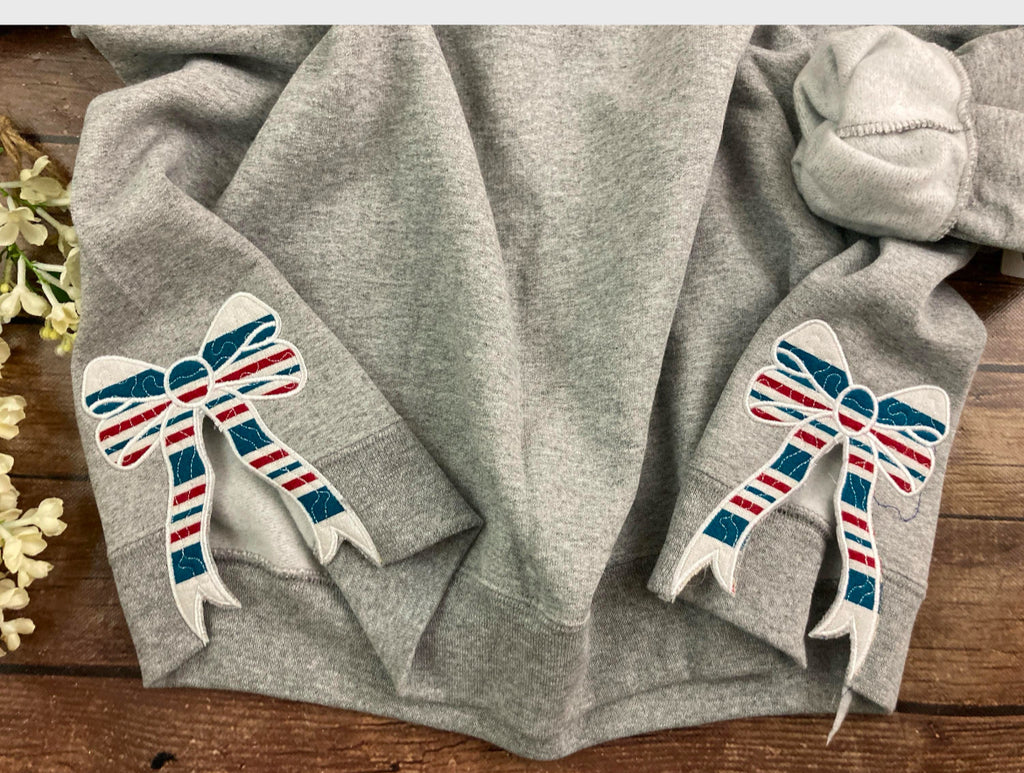 Nurse keepsake sweatshirt with side bows from a hospital swaddle blanket - design close up