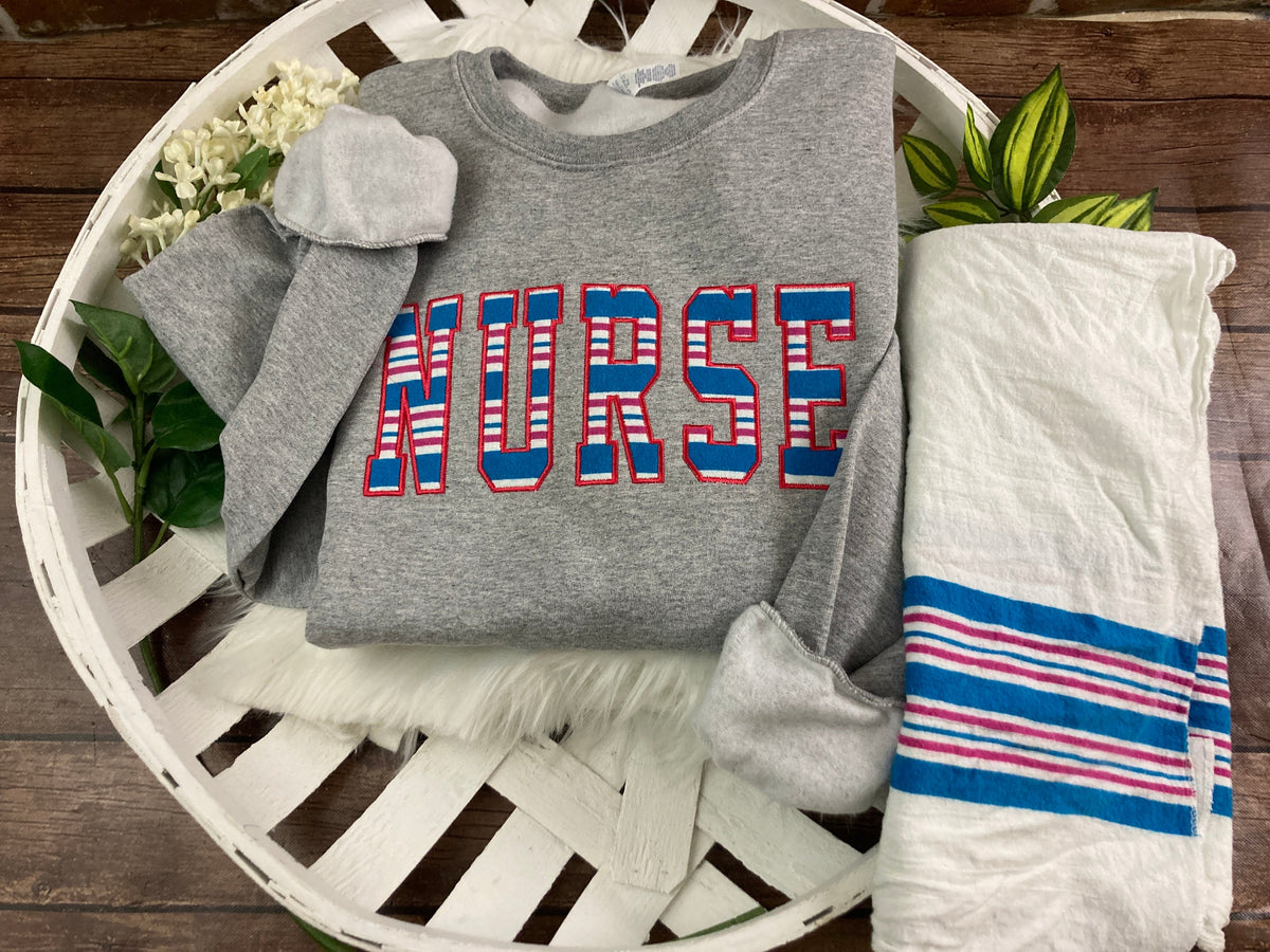 Bulk order nurse keepsake sweatshirts appliqued from hospital blankets