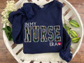 In my nurse era embroidered sweatshirt with rainbow heart EKG design