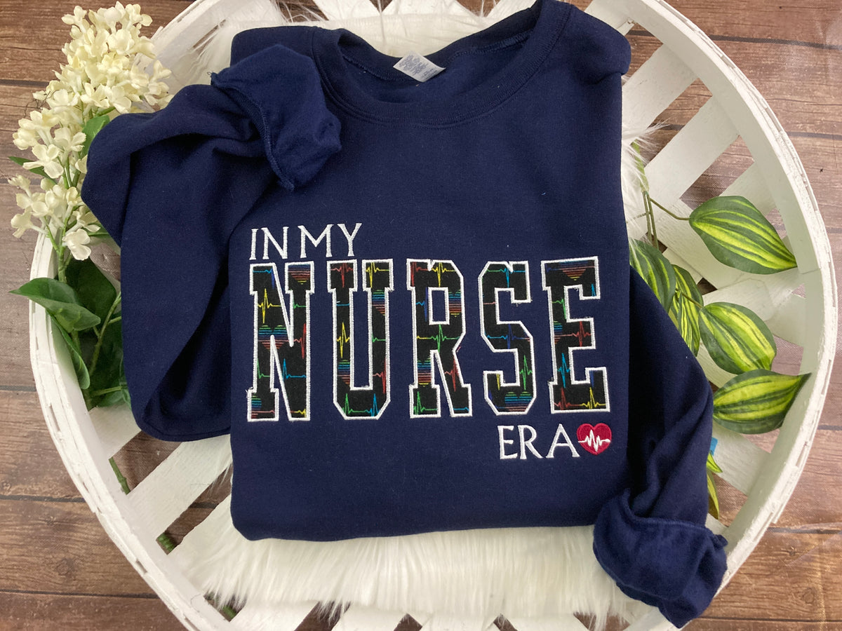 In my nurse era embroidered sweatshirt with rainbow heart EKG design
