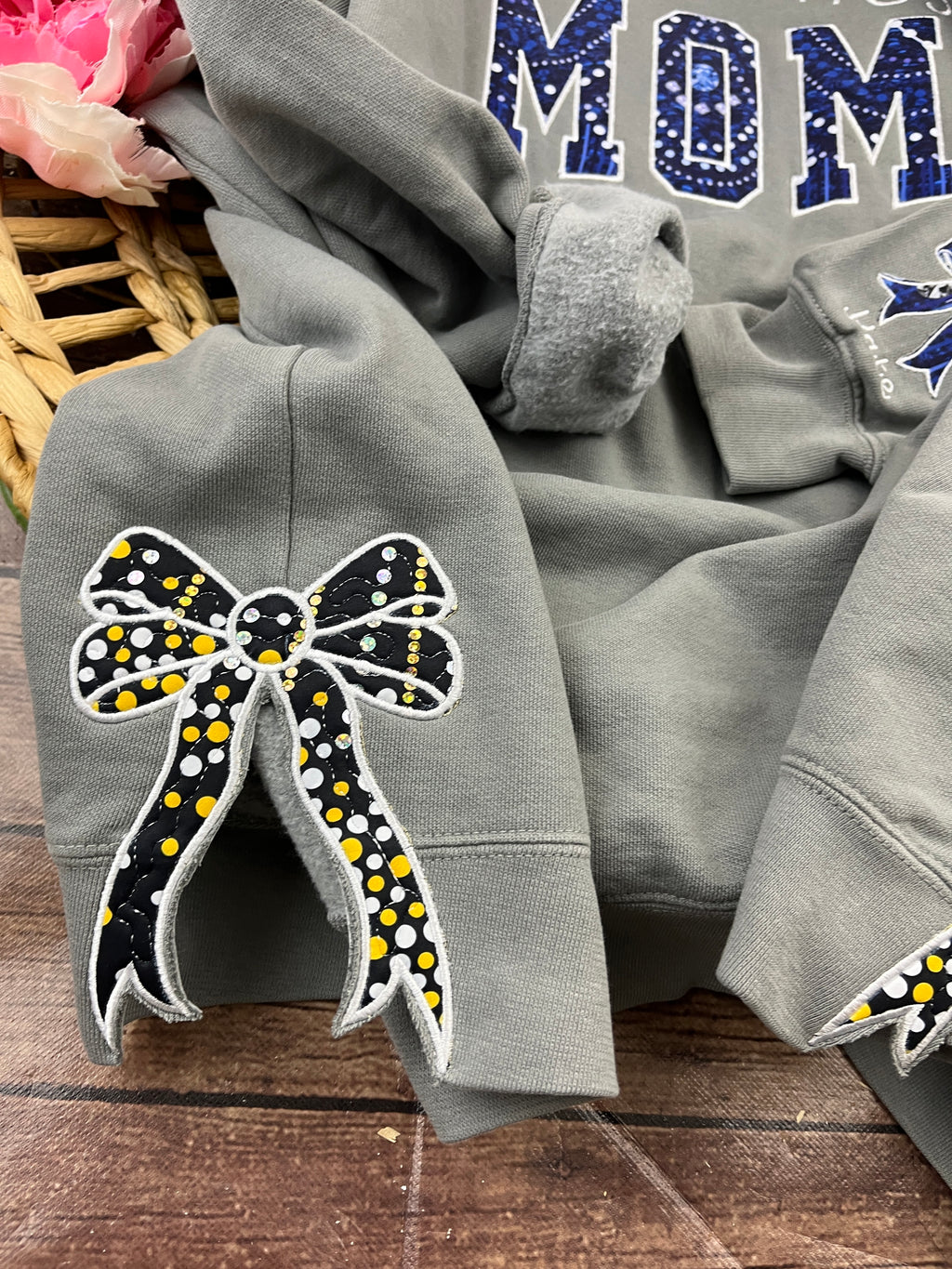 Add on side bows made from baby clothes for a keepsake sweatshirt