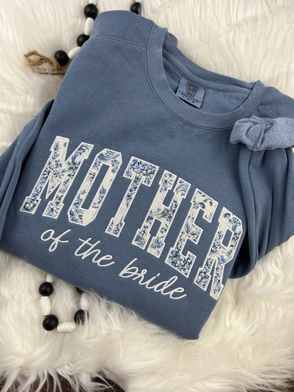 Mother of the bride shirt with floral applique detail - detail view