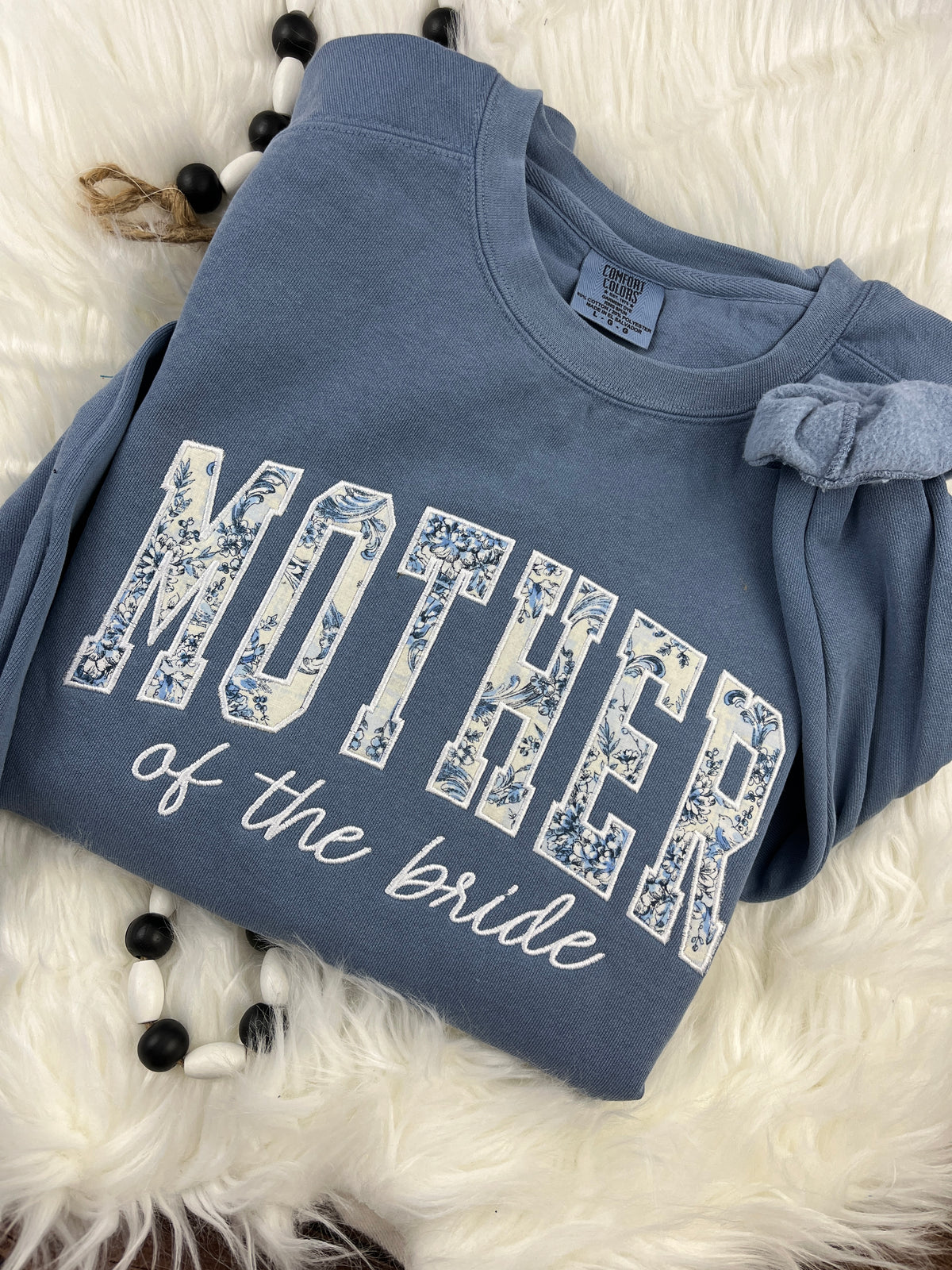 Mother of the bride shirt with floral applique detail - detail view