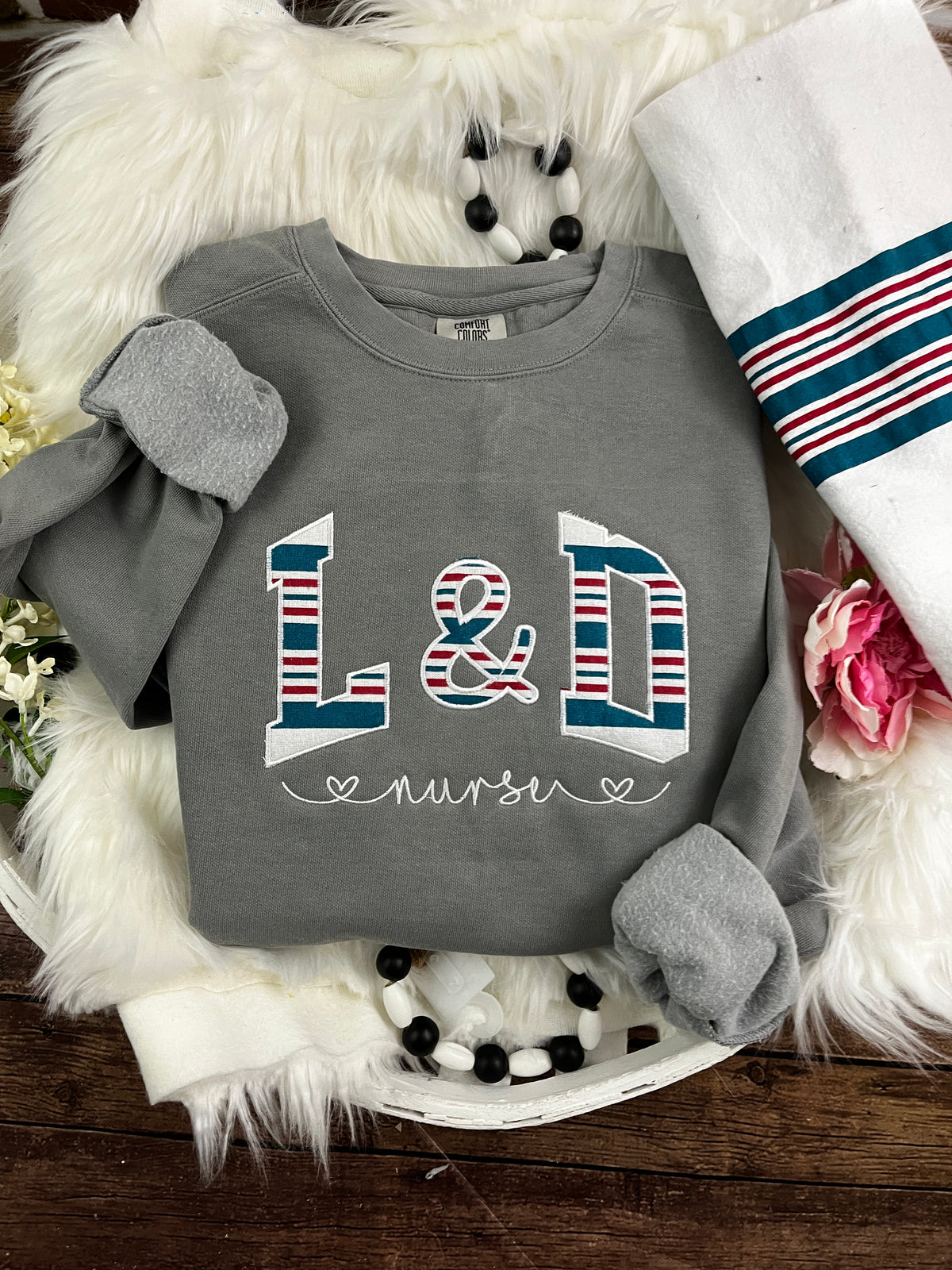 Curved labor and delivery nurse keepsake sweatshirt from swaddle blanket - detail view