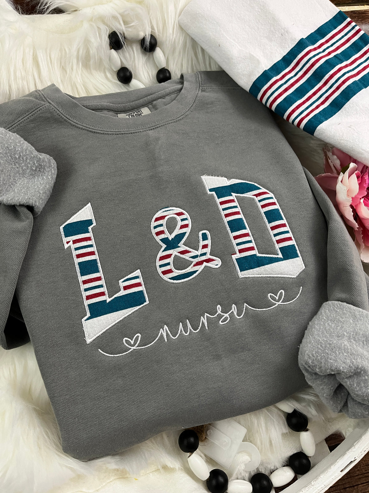 Curved labor and delivery nurse keepsake sweatshirt from swaddle blanket