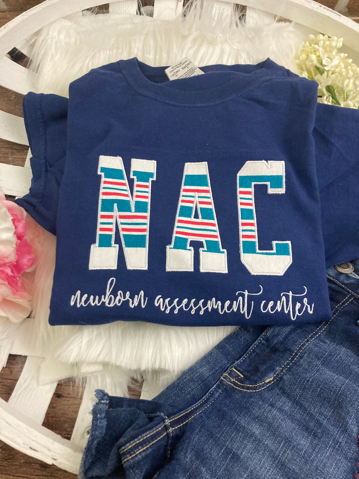 Bulk NAC nurse keepsake sweatshirts appliqued from hospital baby blankets - design close up