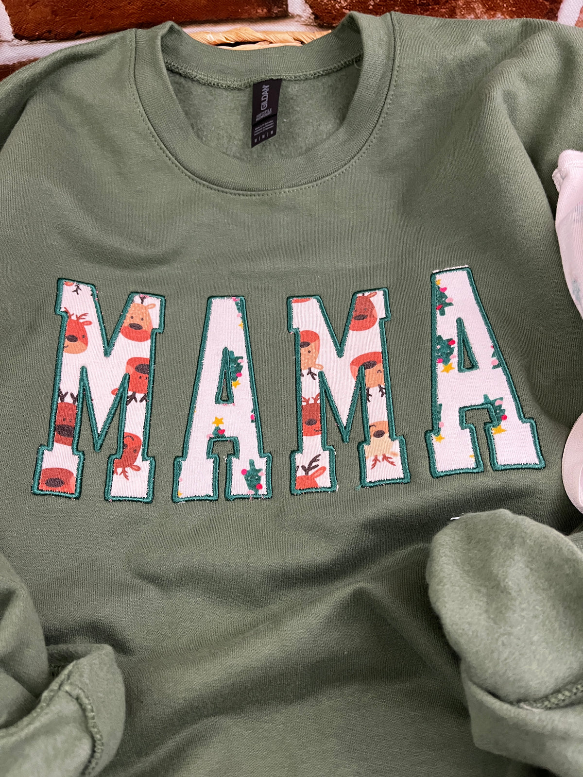 Mama keepsake sweatshirt with side bows appliqued from baby clothes - second detail view