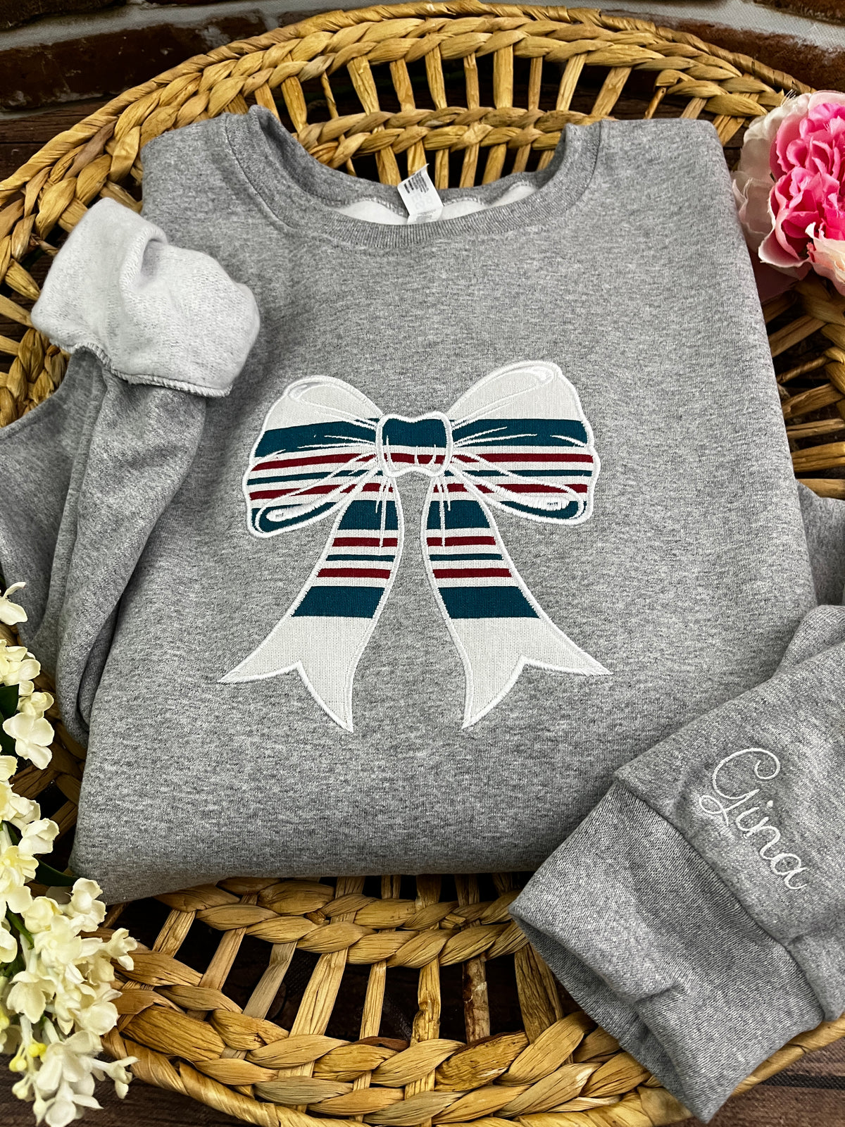 Nurse bow sweatshirt appliqued from a baby hospital swaddle blanket - close up view