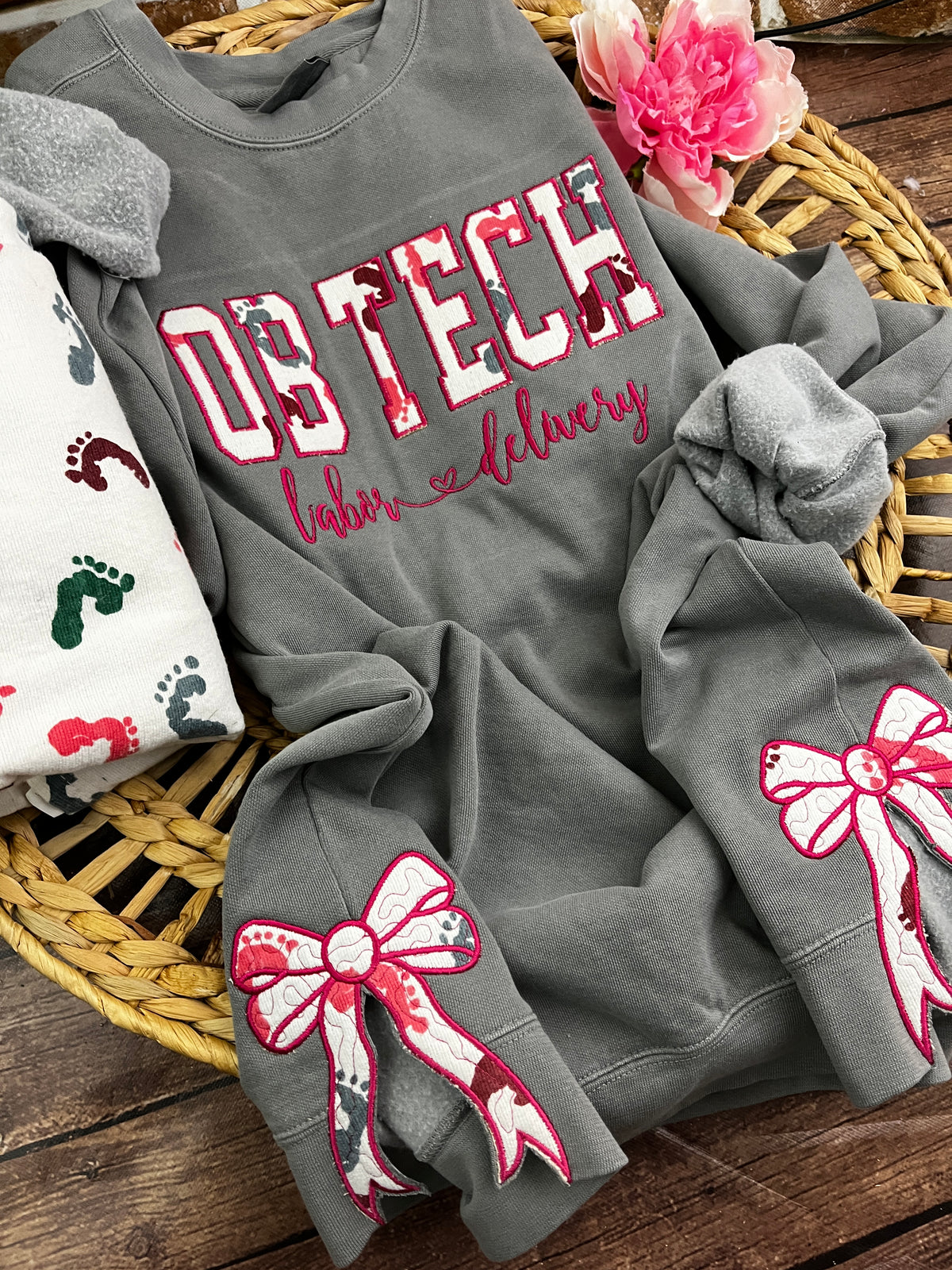 OB tech nurse sweatshirt with side bows from a hospital swaddle blanket - close up view