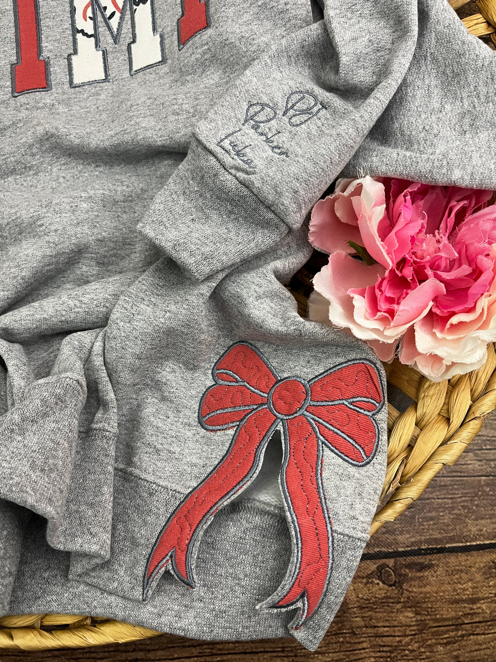 Add on side bows made from baby clothes for a keepsake sweatshirt - detail view