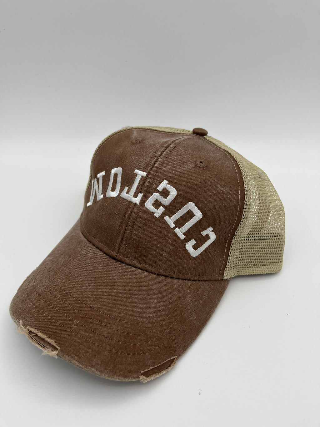 Custom backward flipped text embroidered adjustable cap - close up view