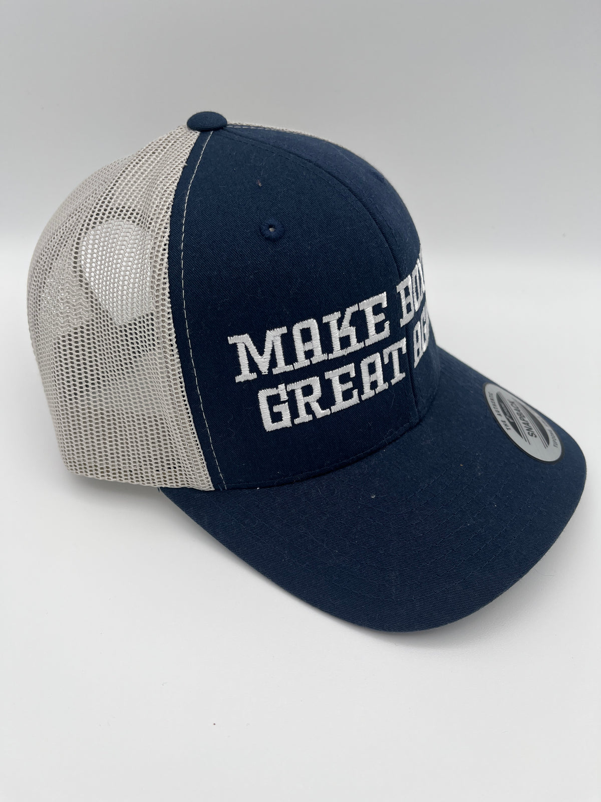Boxing slogan embroidered adjustable trucker cap - close up view
