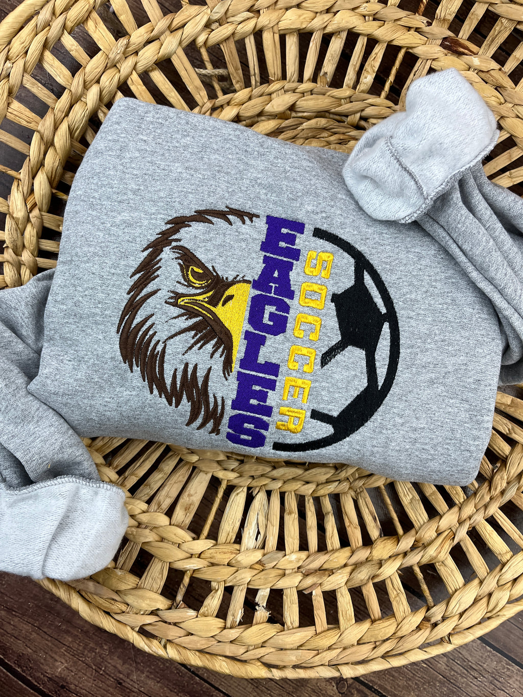 Custom embroidered soccer team sweatshirt for game day - close up view