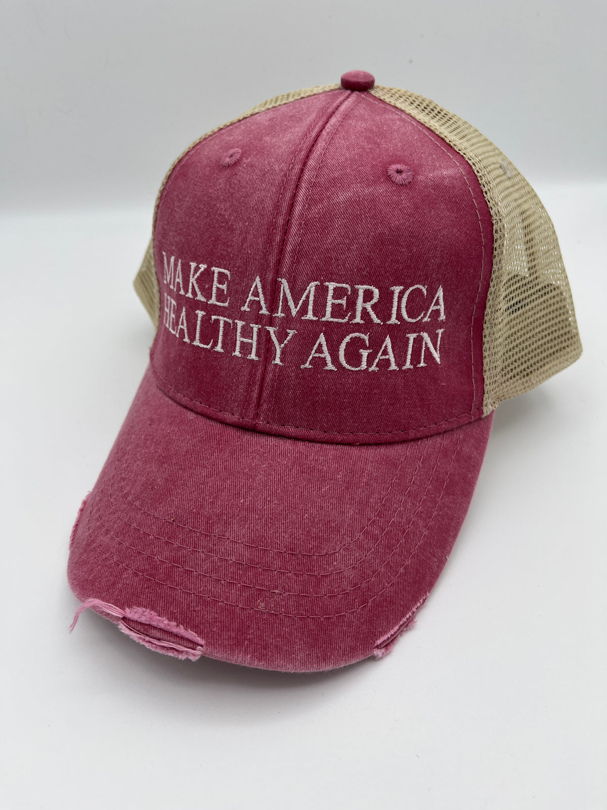 Health slogan embroidered adjustable trucker cap - close up view
