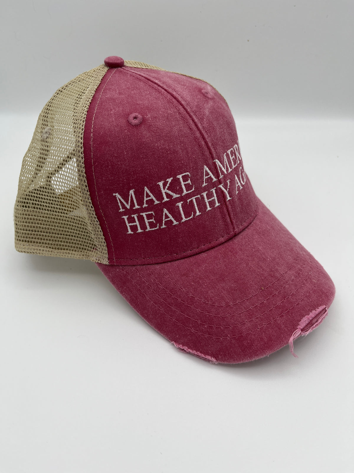 Health slogan embroidered adjustable trucker cap - detail view