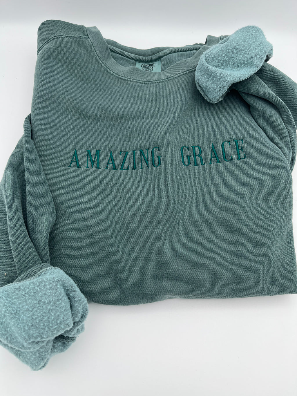 Amazing Grace embroidered hymn Christian sweatshirt - close up view