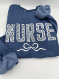Coquette nurse sweatshirt with applique and embroidered bow