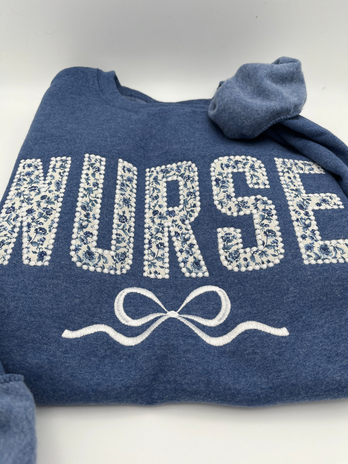 Coquette nurse sweatshirt with applique and embroidered bow - alternate view