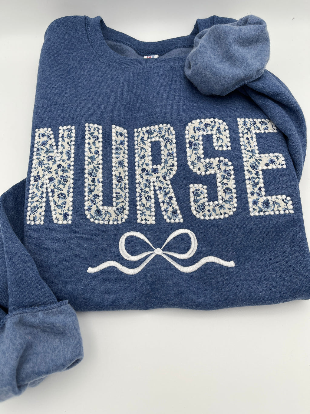 Coquette nurse sweatshirt with applique and embroidered bow - second detail view