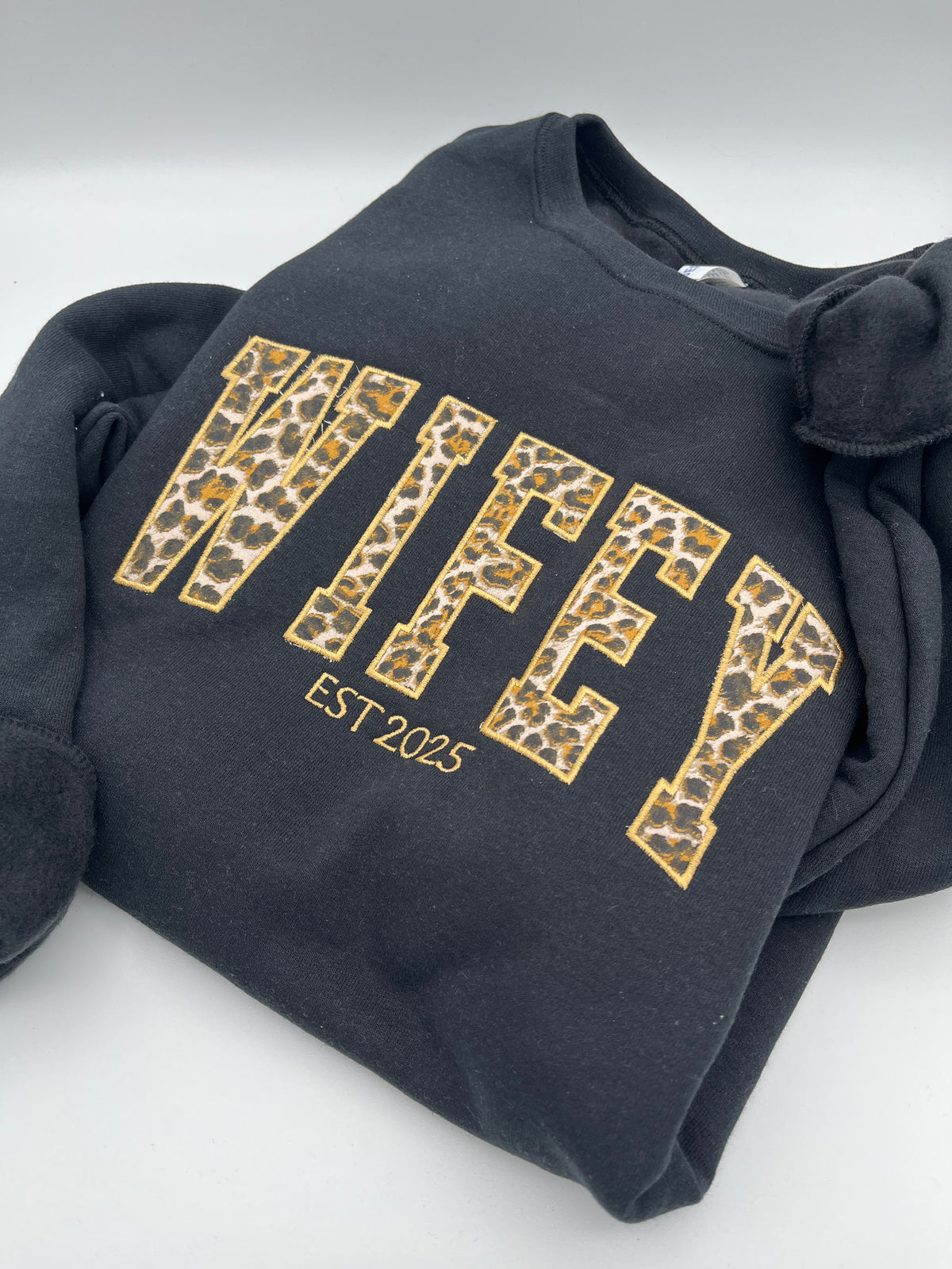 Curved WIFEY applique sweatshirt with cheetah print lettering and custom year - detail view 3