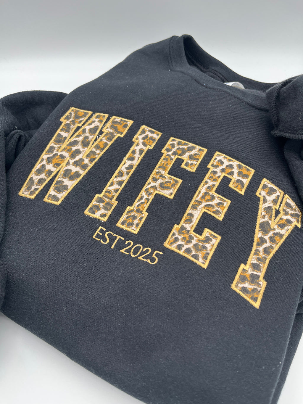 Curved WIFEY applique sweatshirt with cheetah print lettering and custom year - detail view 2