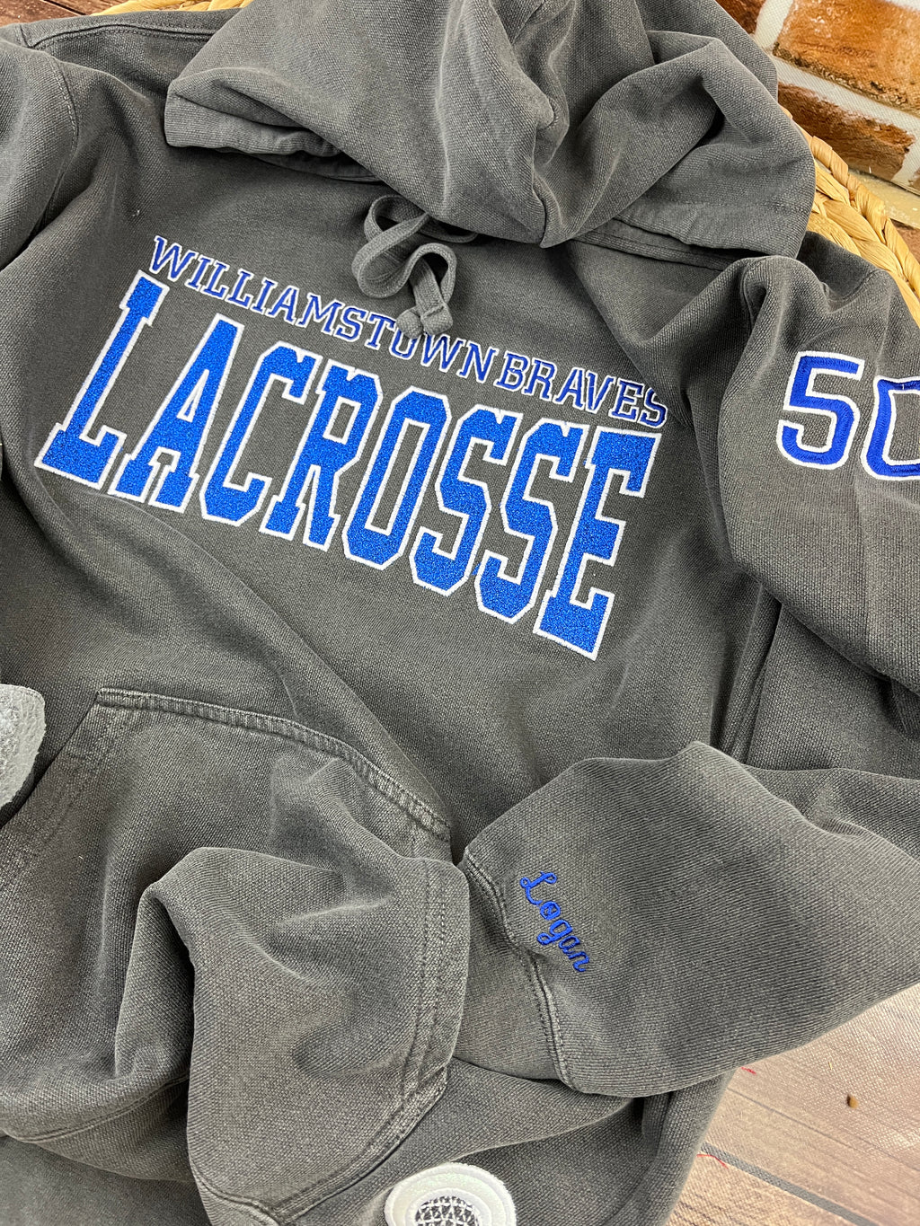 Custom lacrosse sweatshirt with glitter applique school name embroidery - detail view 5