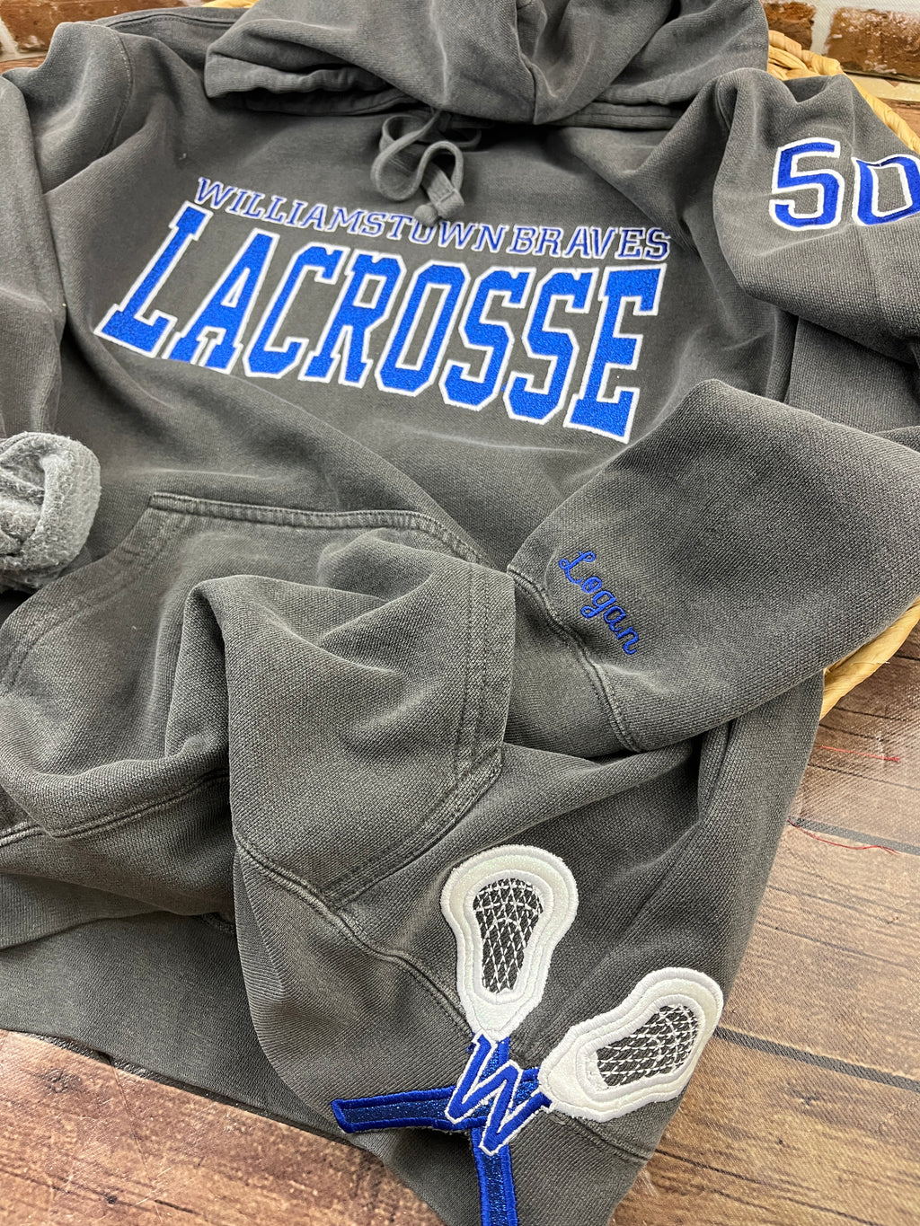 Custom lacrosse sweatshirt with glitter applique school name embroidery - detail view 2