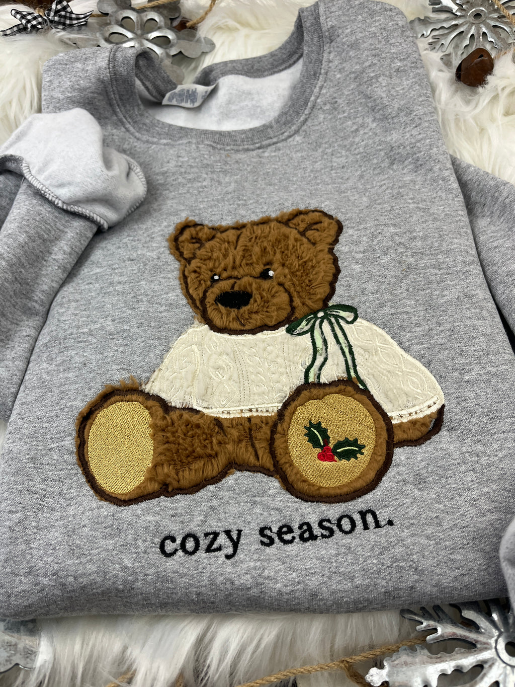 Christmas bear sweatshirt with brown sherpa applique and holly paw design - detail view 3